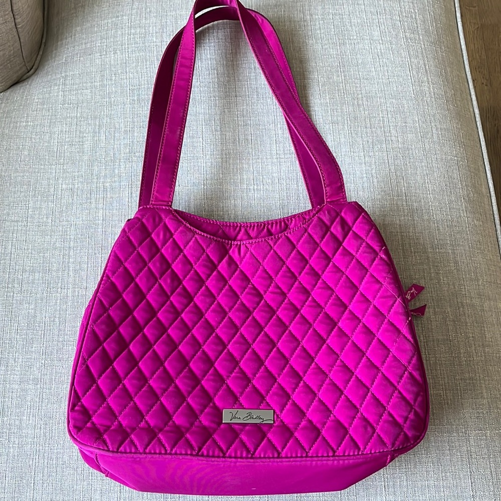 Vera Bradley fuchsia handbag with 2 handles. Gently used. Many pockets.